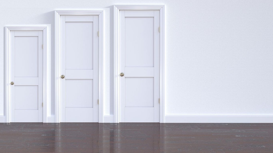 Modern white doors of different sizes shown in a product display