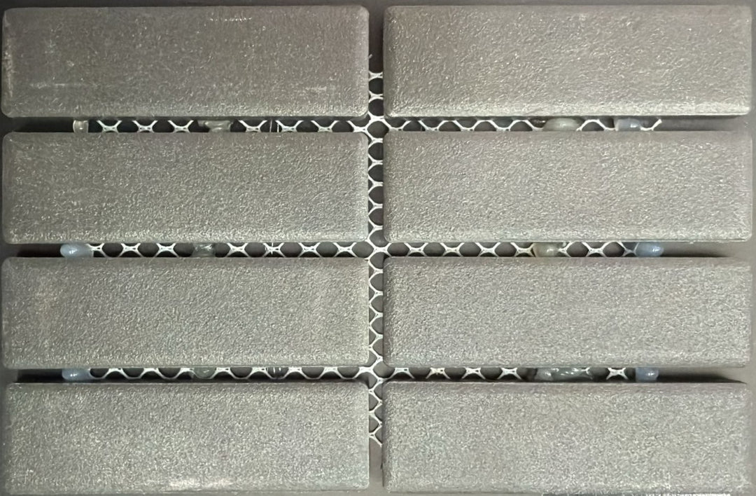 1867 Tile TYPE Collection: mosaic tiles for floor and wall in anthracite, 1"x3" size. Available at Advanced Flooring Waterloo. 