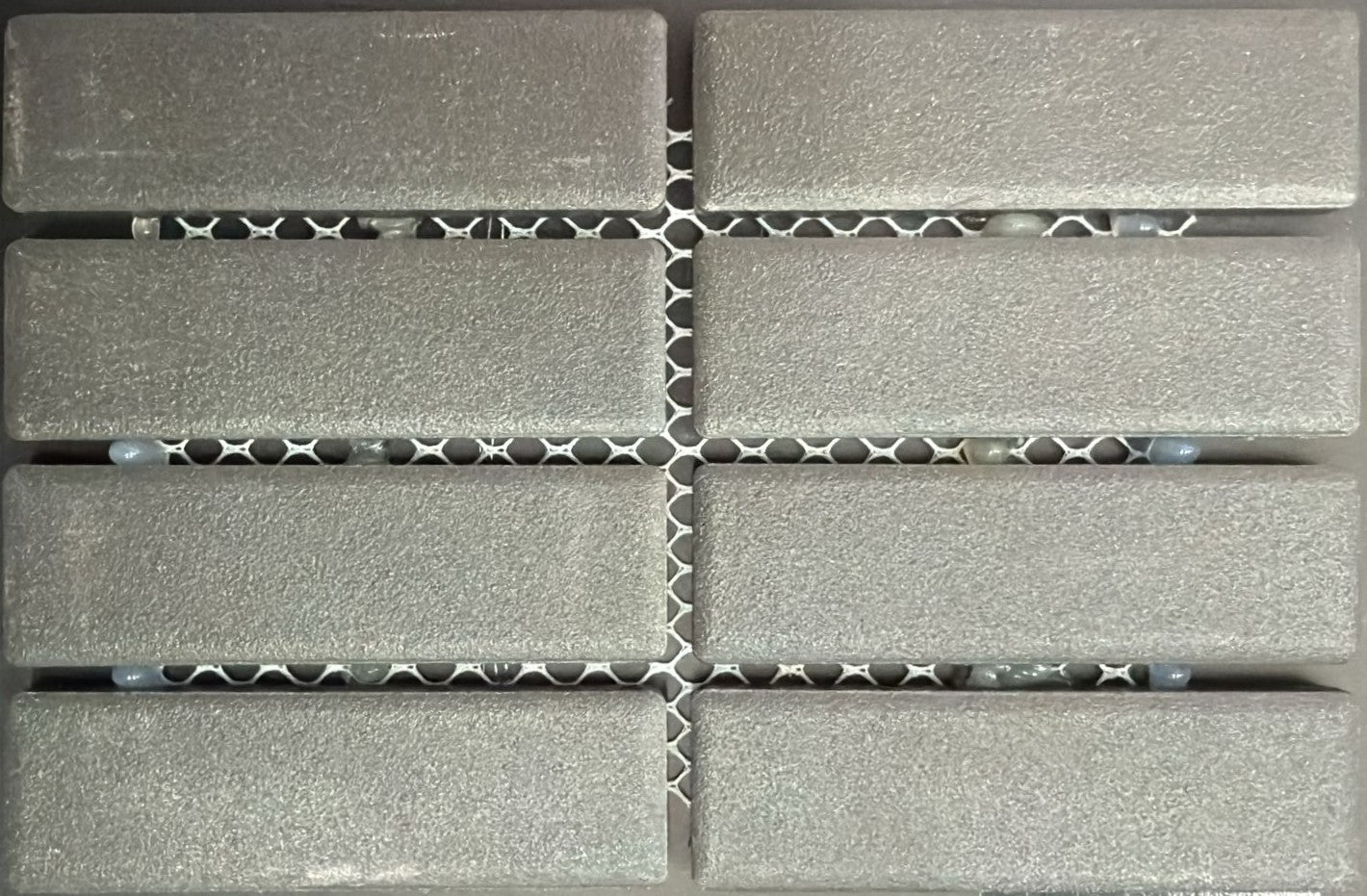 1867 Tile TYPE Collection: mosaic tiles for floor and wall in anthracite, 1"x3" size. Available at Advanced Flooring Waterloo. 
