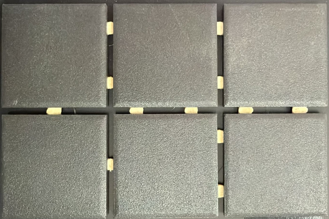 1867 Tile TYPE Collection: mosaic tiles for floor and wall in anthracite, 2"x2" size. Available at Advanced Flooring Waterloo. 