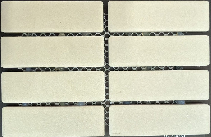 1867 Tile TYPE Collection: mosaic tiles for floor and wall in bone, 1"x3" size. Available at Advanced Flooring Waterloo. 