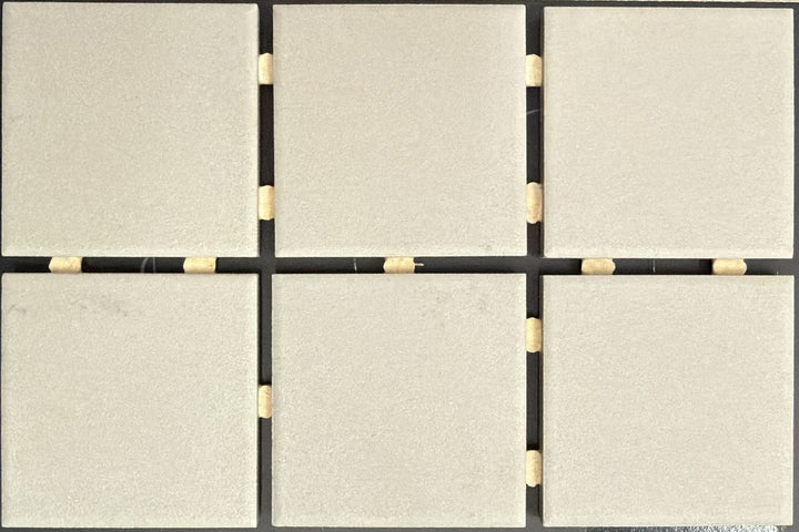 1867 Tile TYPE Collection: mosaic tiles for floor and wall in grey, 2"x2" size. Available at Advanced Flooring Waterloo. 