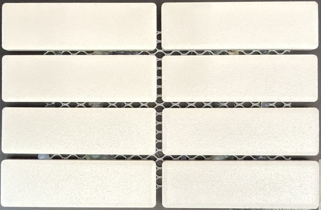 1867 Tile TYPE Collection: mosaic tiles for floor and wall in white, 1"x3" size. Available at Advanced Flooring Waterloo. 