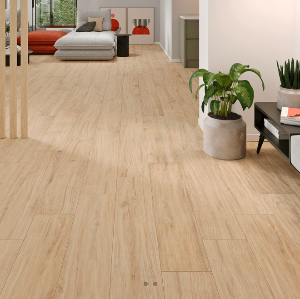 Porcelain tiles with a wood-like appearance installed on the floor of a modern living space.