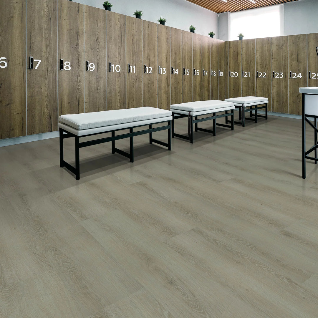 Wooden locker room with numbered lockers and white benches.