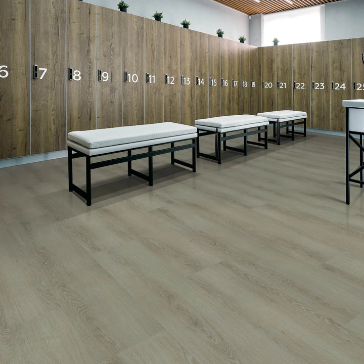 Wooden locker room with numbered lockers and white benches.