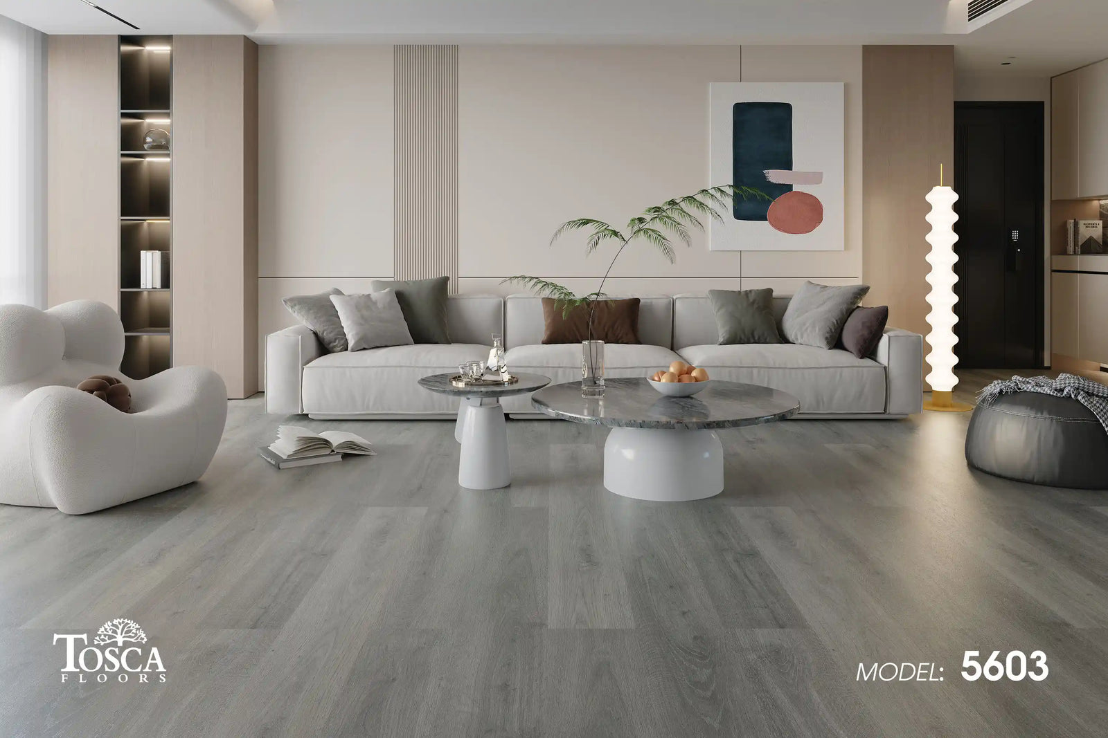 Modern living room with gray flooring, furniture, and artwork.