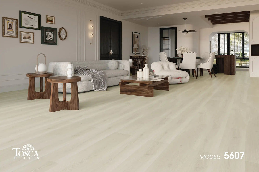 Living room with light-colored flooring, furniture, and decor.