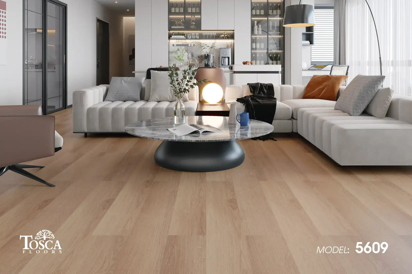 Modern living room with gray sectional sofa, wooden floor, and Tosca Floors branding.