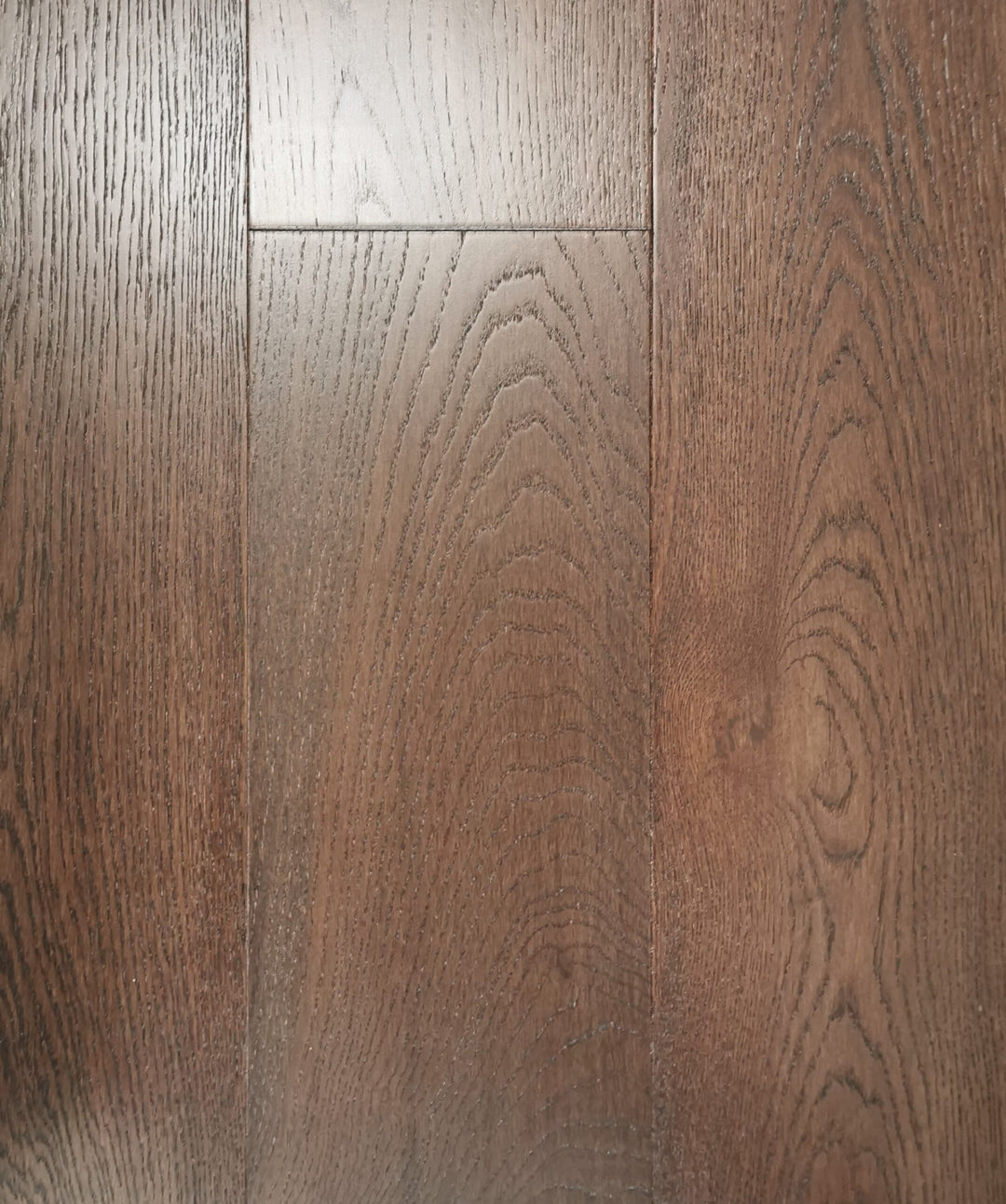 A close-up of Mocha European Oak 7.5" & 4mm Veneer layer Engineered Hardwood from Riche.