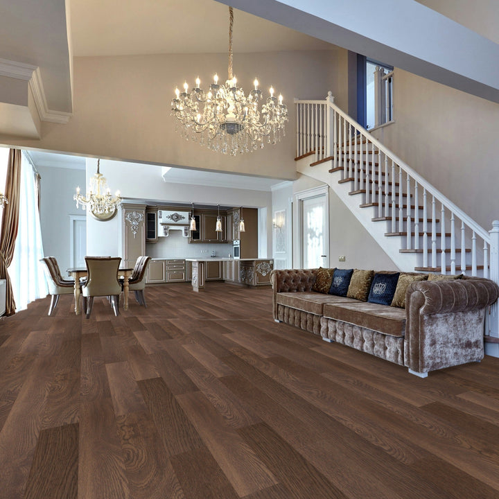 Luxurious living room with wooden floor, chandelier, and staircase.