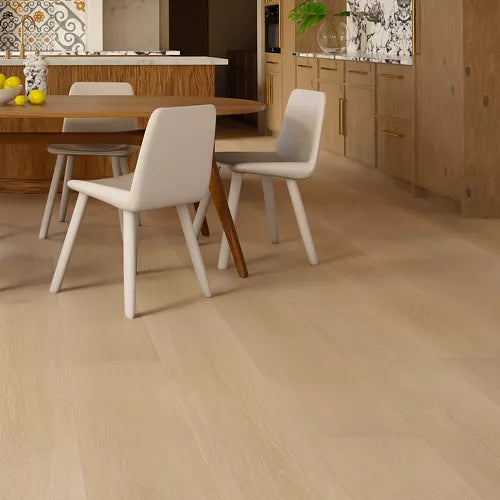 Light oak hardwood flooring in a modern dining room setting with a wooden dining table and white chairs.