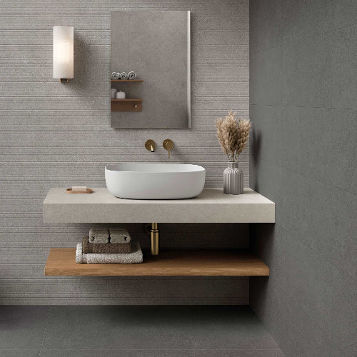 Modern bathroom vanity with white sink, wooden shelf, and decorative elements.