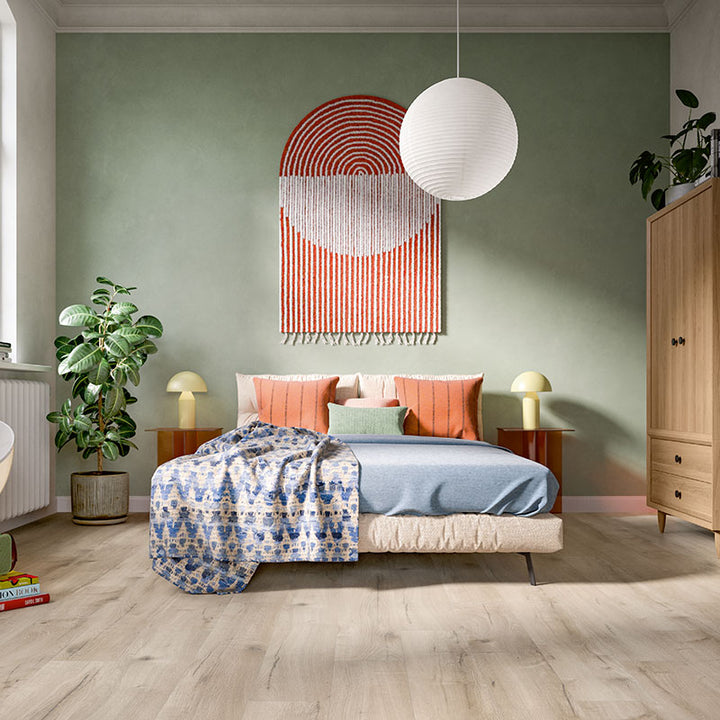 Modern bedroom with a bed, nightstands, and decorative wall art.