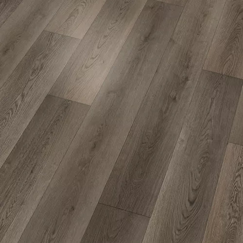 Gray-brown wood-look flooring planks arranged in a herringbone pattern, showing detailed grain textures.