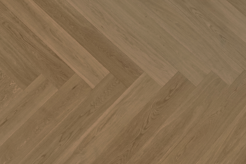 Close-up of a wooden floor with a herringbone pattern
