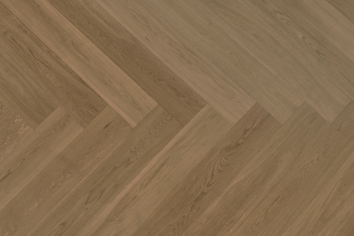 Close-up of a wooden floor with a herringbone pattern