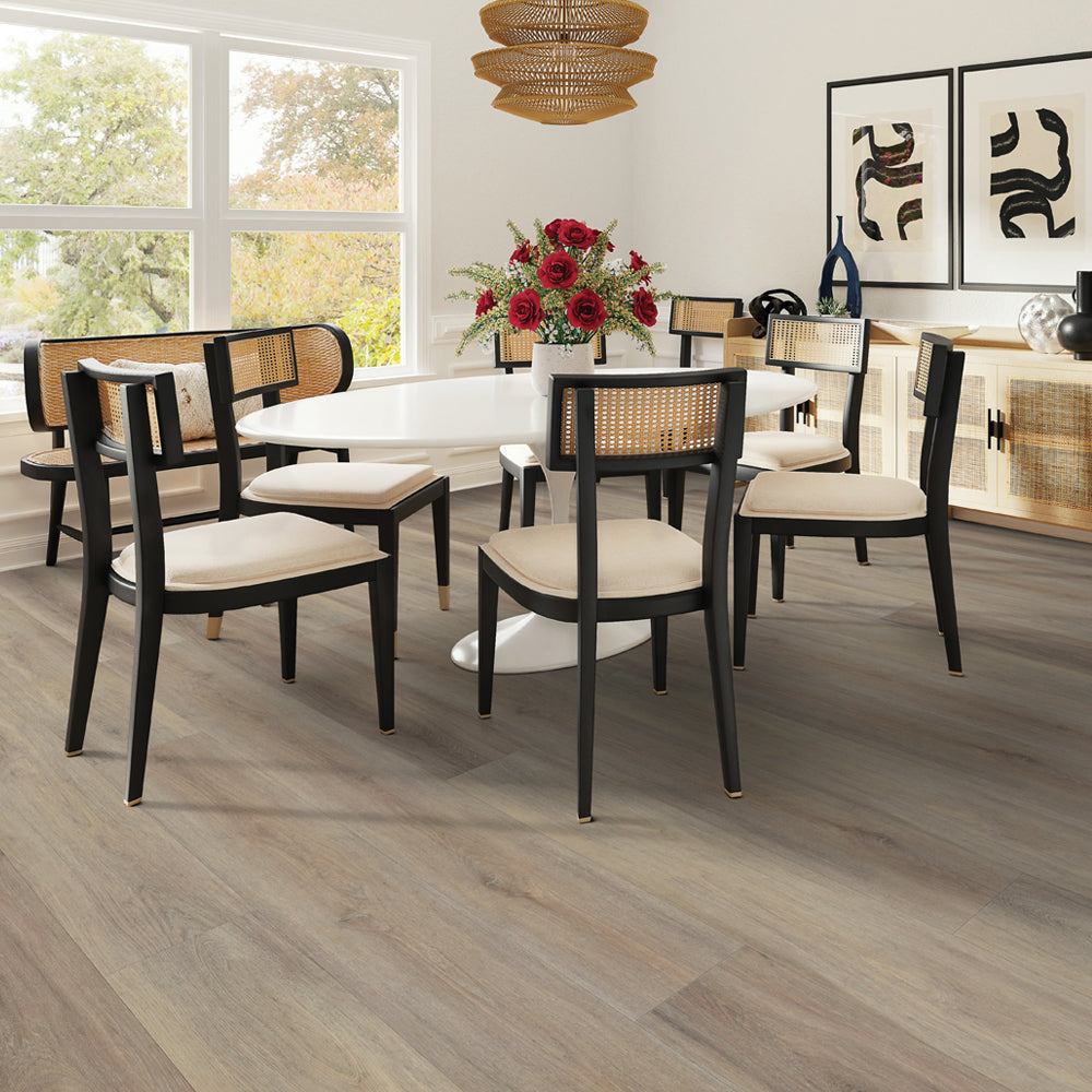 Dining room with Beaulieu SPC vinyl flooring in Galapagos 2319
color. Available at Advanced Flooring Waterloo. Completely 100% waterproof, pet-friendly, and highly stain-resistant.