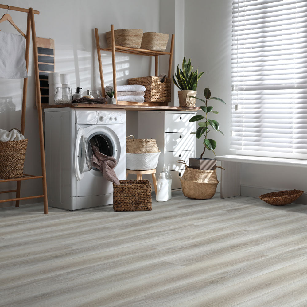 Laundry room with Beaulieu 8.5mm WPC vinyl flooring in Acorn 6048 color. Installation services in Waterloo & Kitchener, and Canada-wide delivery available.