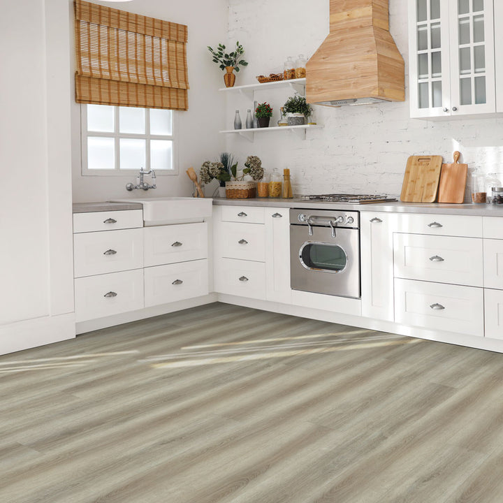Modern kitchen with Beaulieu 8.5mm WPC vinyl flooring in Barley 6049 color. Installation services in Waterloo & Kitchener, and Canada-wide delivery available.
