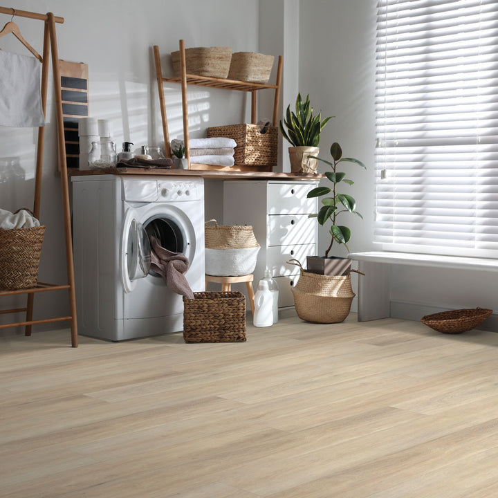 Laundry room with Beaulieu 8.5mm WPC vinyl flooring in Caraway 6050 color. Installation services in Waterloo & Kitchener, and Canada-wide delivery available.
