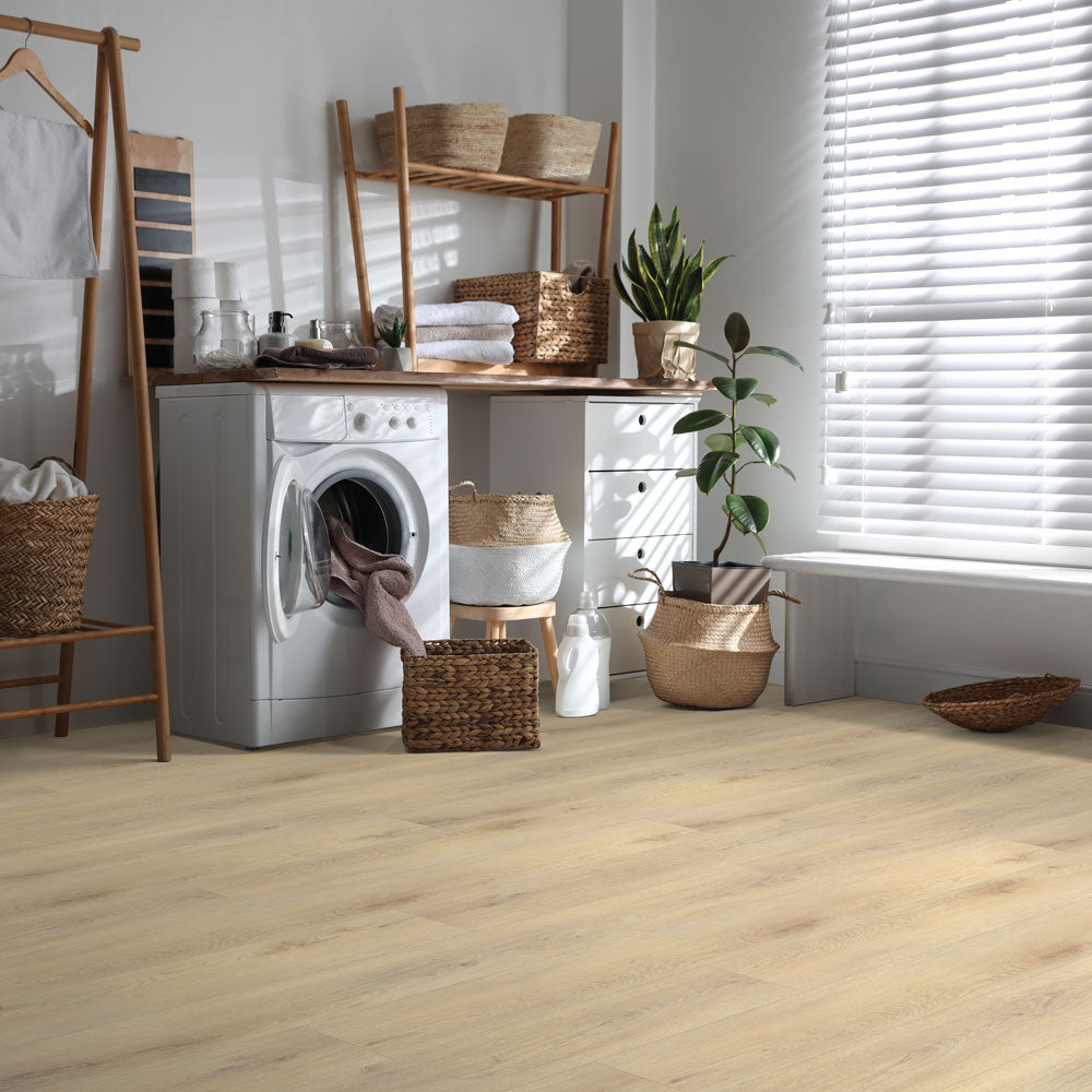 Laundry room with Beaulieu 8.5mm WPC vinyl flooring in Gingko 6051 color. Installation services in Waterloo & Kitchener, and Canada-wide delivery available.