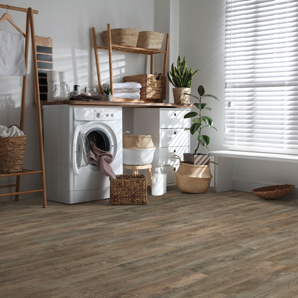 Laundry room with Beaulieu 8.5mm WPC vinyl flooring in Hanza 6039 color. Installation services in Waterloo & Kitchener, and Canada-wide delivery available.