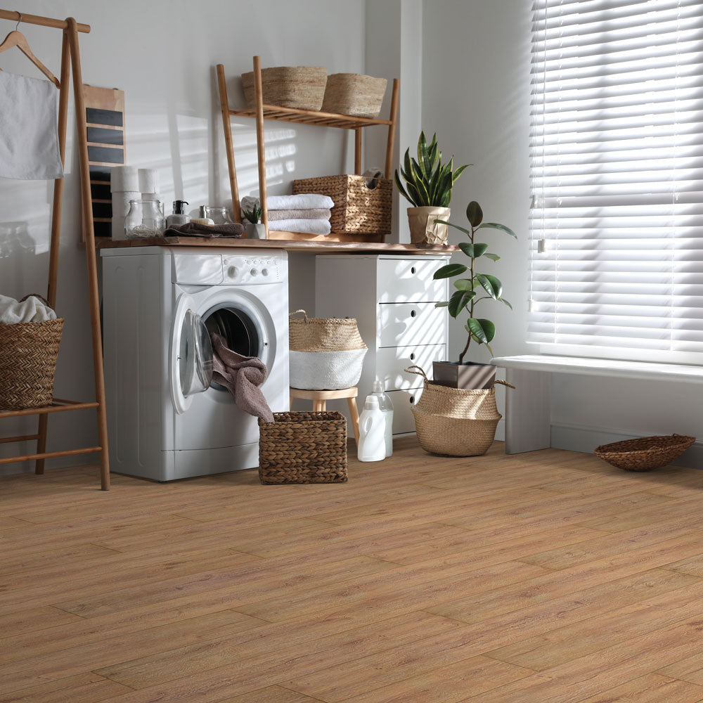 Laundry room with Beaulieu 8.5mm WPC vinyl flooring in Hazelnut 6041 color. Installation services in Waterloo & Kitchener, and Canada-wide delivery available.