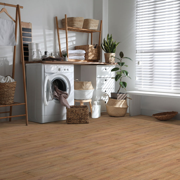 Laundry room with Beaulieu 8.5mm WPC vinyl flooring in Hazelnut 6041 color. Installation services in Waterloo & Kitchener, and Canada-wide delivery available.