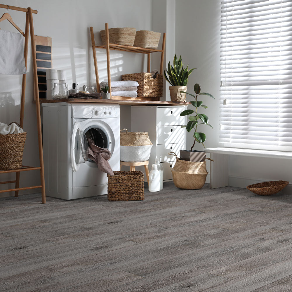 Modern laundry room with Beaulieu 8.5mm WPC vinyl flooring in Karuka 6037 color. Installation services in Waterloo & Kitchener, and Canada-wide delivery available.