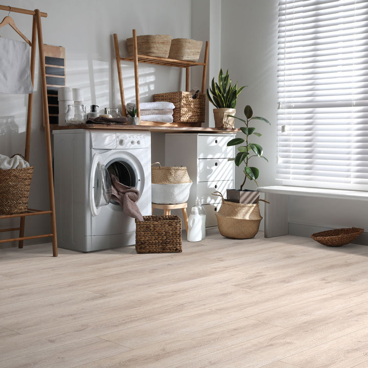 Modern laundry room with Beaulieu 8.5mm WPC vinyl flooring in Macadamia 6036 color. Installation services in Waterloo & Kitchener, and Canada-wide delivery available.
