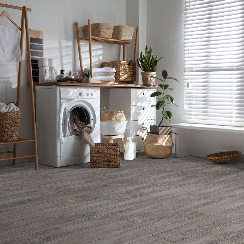 Laundry room with Beaulieu 8.5mm WPC vinyl flooring in Pinenut 6047 color. Installation services in Waterloo & Kitchener, and Canada-wide delivery available.