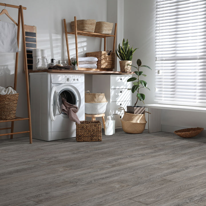 Laundry room with Beaulieu 8.5mm WPC vinyl flooring in Pinenut 6047 color. Installation services in Waterloo & Kitchener, and Canada-wide delivery available.