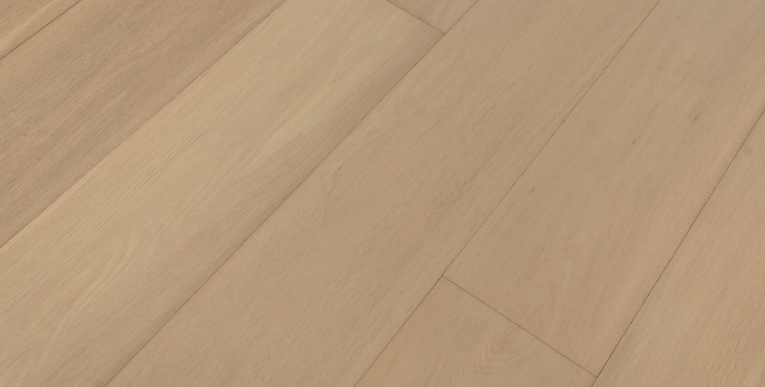 Close-up of a wooden floor with a herringbone pattern