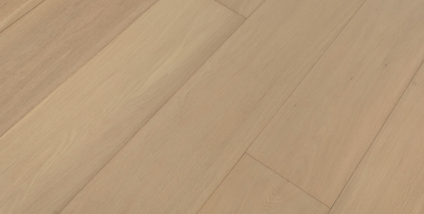 Close-up of a wooden floor with a herringbone pattern