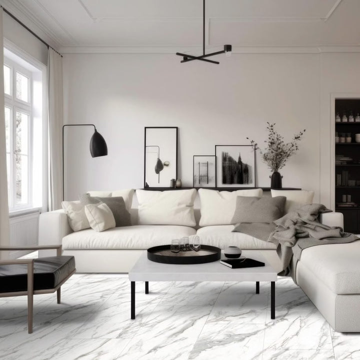 Modern living room with a white sofa, coffee table, and decorative elements.