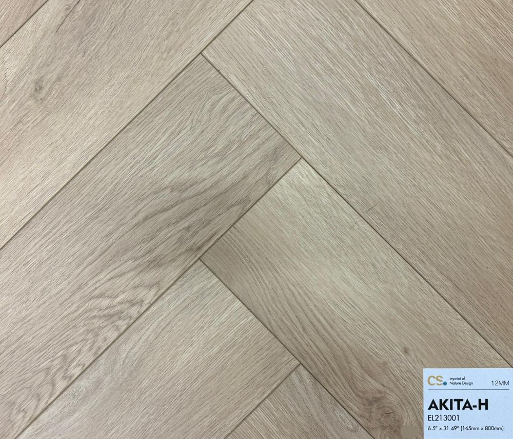 Canadian Standard waterproof laminate flooring in elegant herringbone style, featuring ultra-realistic light oak wood texture and 12mm thickness. Available at Advanced Flooring Waterloo.