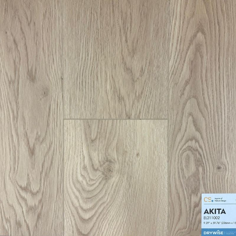 Close-up view of Canadian Standard Akita waterproof laminate flooring sample showing realistic wood grain texture and 12mm thickness, available from Advanced Flooring Waterloo with installation in Kitchener-Waterloo and Canada-wide delivery.