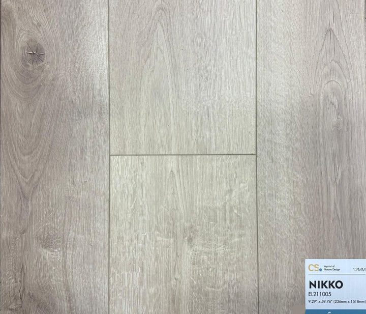 Canadian Standard Nikko waterproof laminate flooring sample featuring  a grey undertone wood texture, 12mm thick, durable surface. Available at Advanced Flooring Waterloo.