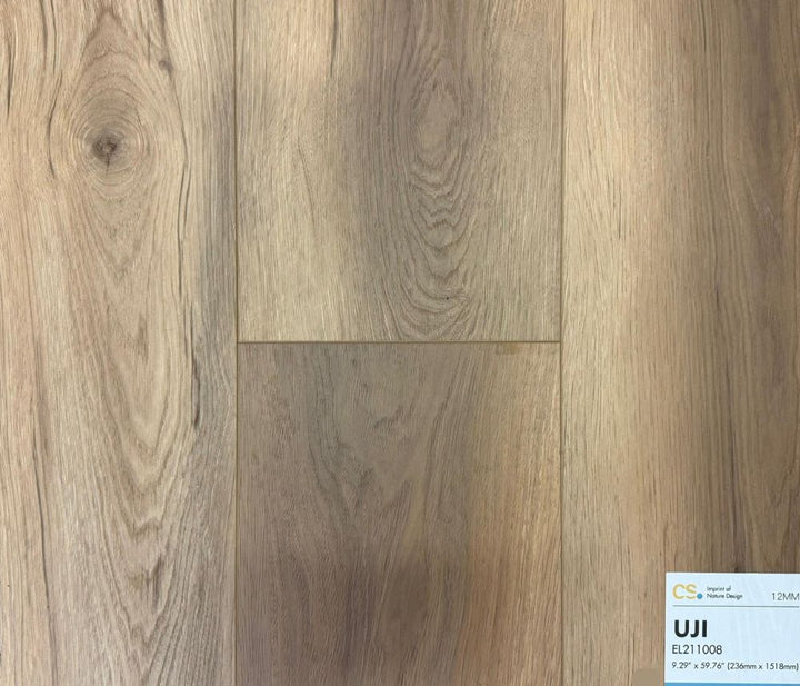 Canadian Standard Uji waterproof laminate flooring sample EL211008 featuring soft brown oak tones and natural wood grain texture in a 12mm durable plank design.