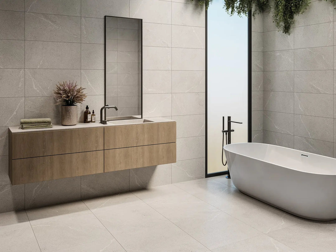 Modern bathroom with wooden vanity, freestanding bathtub, and large window.