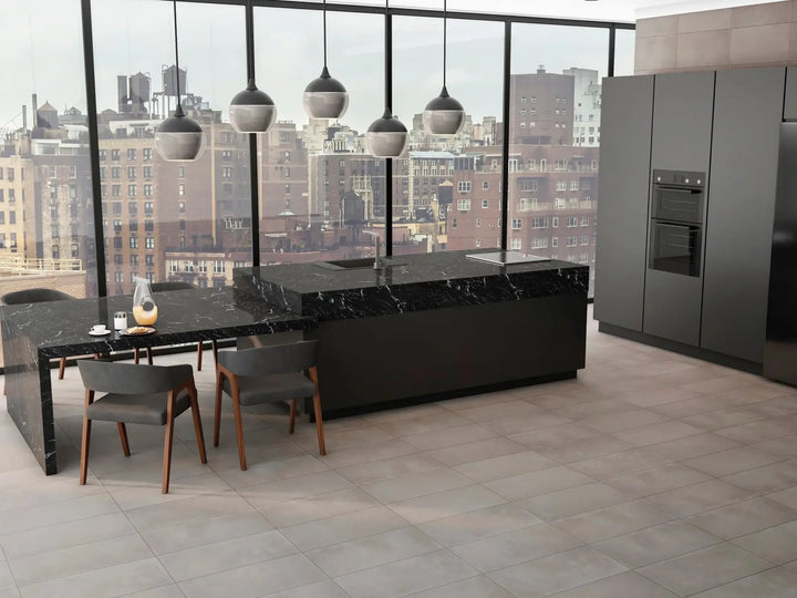 Modern kitchen with black island and dining table in a cityscape view.