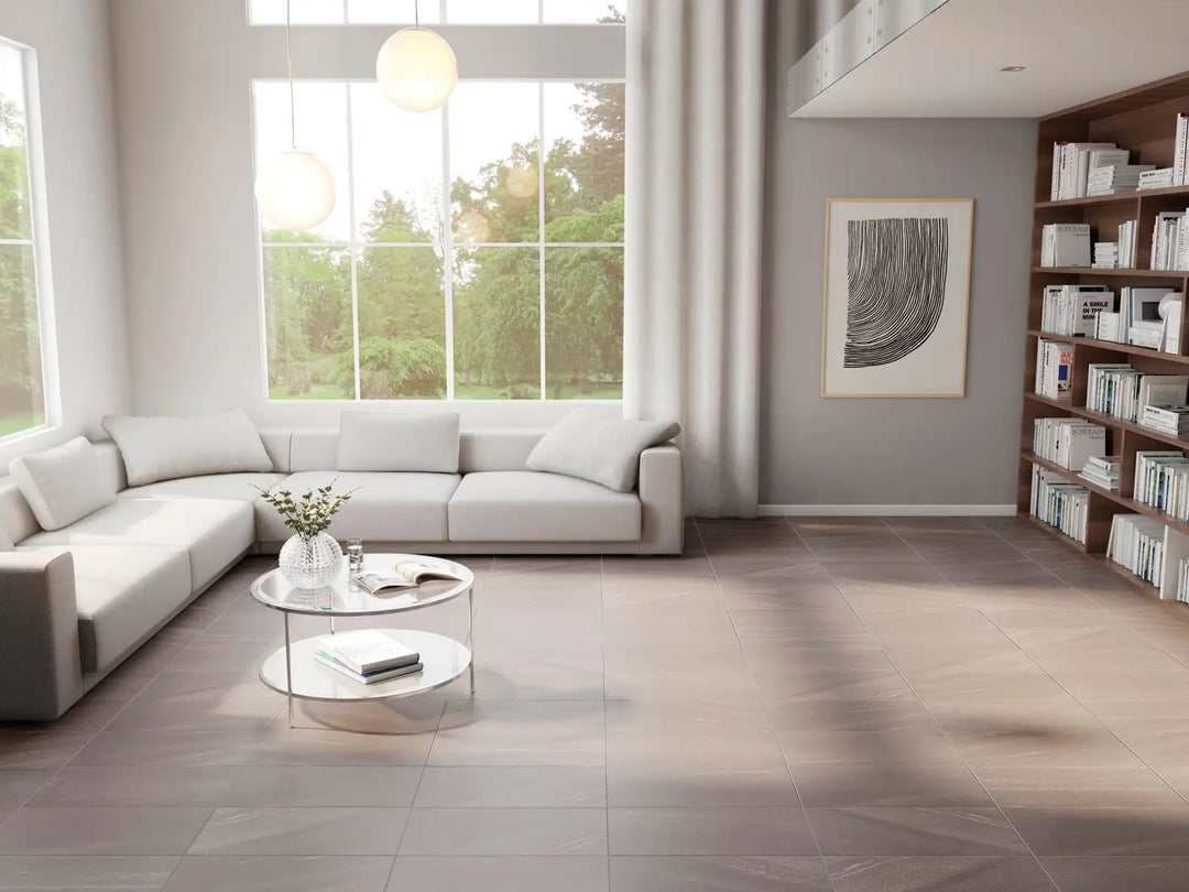 Modern living room with a sectional sofa, coffee table, and bookshelf.