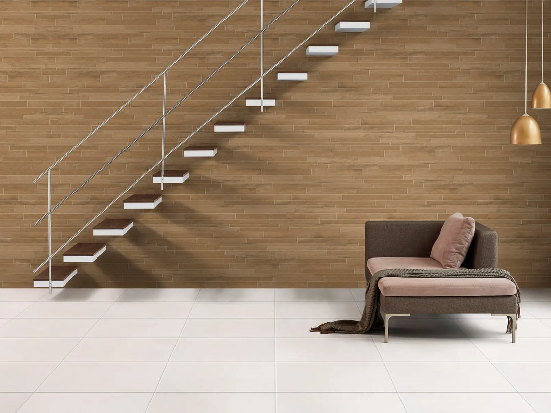 Modern living room with a wooden wall, floating staircase, and a sofa.
