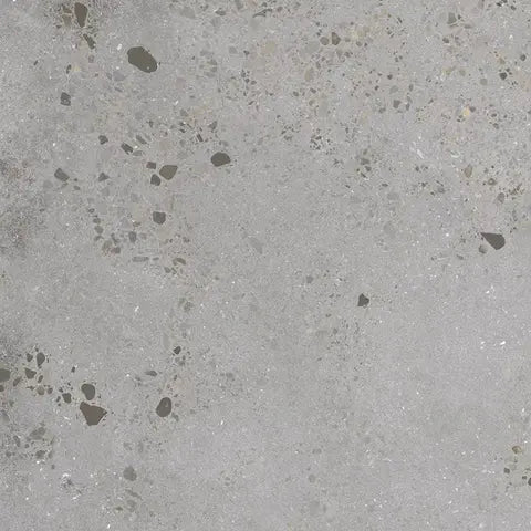 Close-up of a gray concrete surface with small dark specks