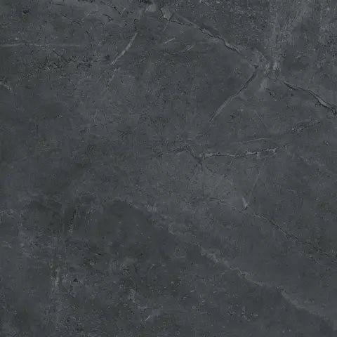 Close-up of dark gray stone surface with visible cracks and texture