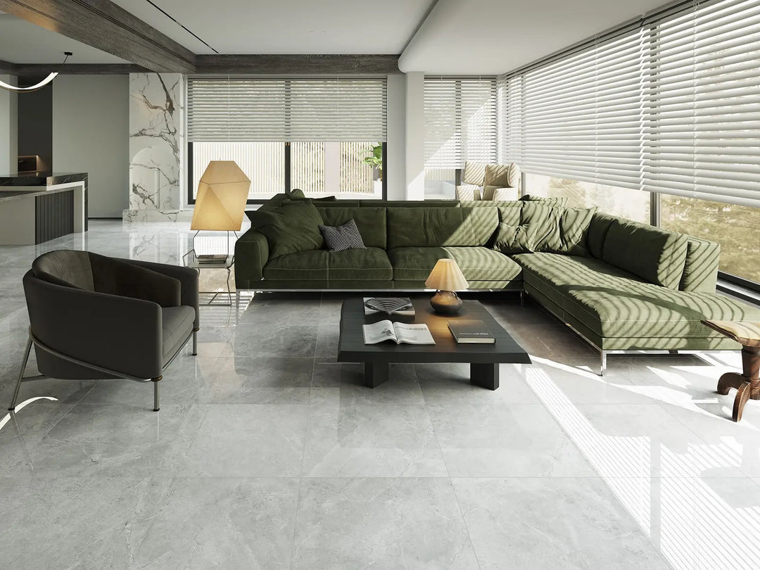 Modern living room with a green sectional sofa, black armchair, and coffee table.