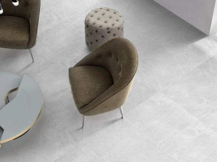 Modern chair and ottoman on a light gray floor