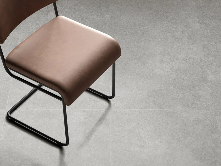 Chair with a brown cushion on a gray floor