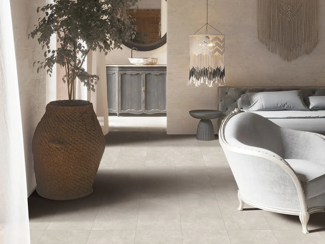 Modern interior with a vase, chair, and decorative light fixture.